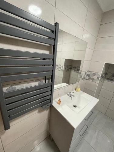 a bathroom with a sink and a mirror at Casa da Martha in Celorico da Beira