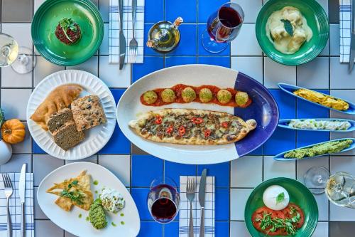 a blue and white tiled table with plates of food at London Heathrow Marriott Hotel in Hillingdon
