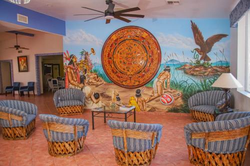 a room with a large painting on the wall at Playa Inn Rocky Point in Puerto Peñasco