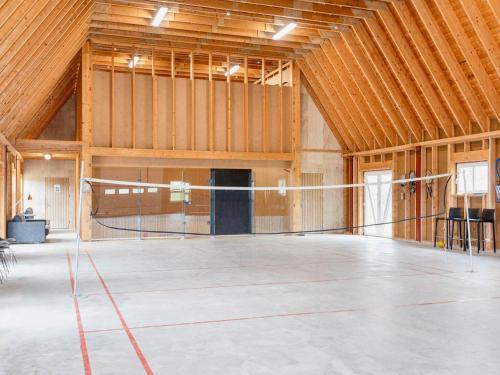a large room with a volleyball net in a building at 20 person holiday home in Karby-By Traum in Karby