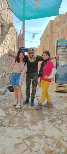 a man and two women standing next to each other at Dana Gardens Hotel in Dana