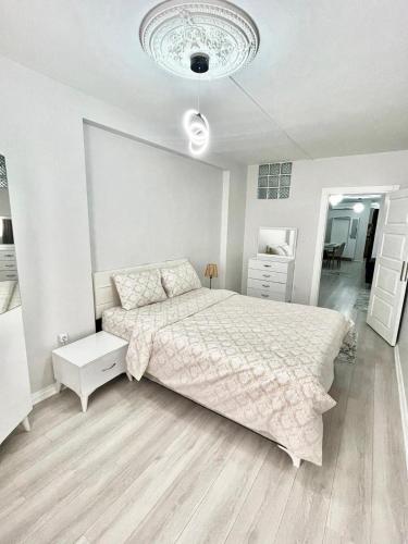 A bed or beds in a room at EYM Apart Hotel Nişantaşı