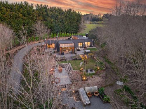 an aerial view of a house with a yard at 5 o'clock Somewhere in Masterton