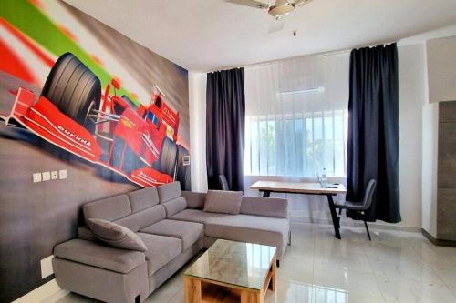 a living room with a couch and a table at Formule 1 in Lomé