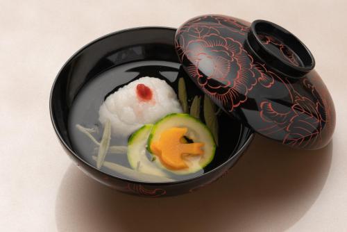 a bowl of food with rice and vegetables in it at Isoaruki no Yuyado Ushiogumo -6 years or older- in Kawazu