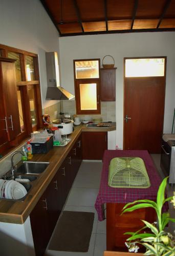 a kitchen with a sink and a counter top at SaDev Lake Villa Bandaragama in Bandaragama