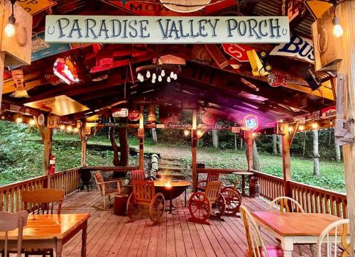 a restaurant with tables and chairs on a patio at Amazing Cabin fireplace and stream #11 in Helen
