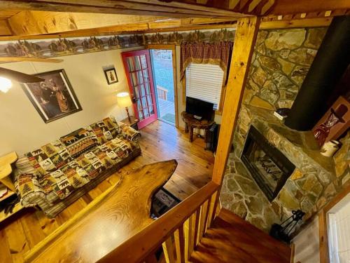 an overhead view of a living room with a large stone fireplace at Amazing Cabin fireplace and stream #11 in Helen