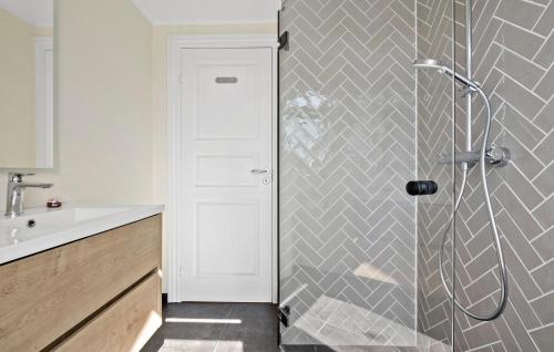 a bathroom with a shower and a sink at 2 Bedroom Pet Friendly Home In Hornbæk in Hornbæk