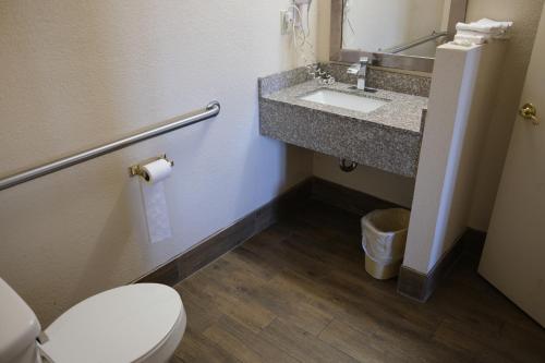 a bathroom with a toilet and a sink at Red Roof Inn Staunton in Staunton