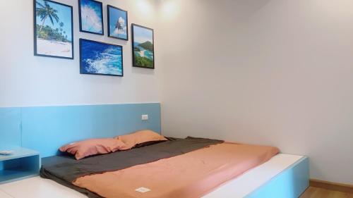Een bed of bedden in een kamer bij Homestay Hạ Long