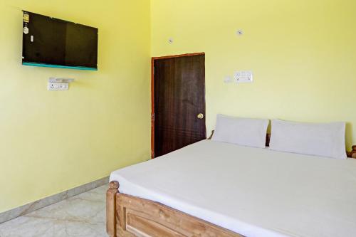 Un ou plusieurs lits dans un hébergement de l'établissement OYO Amargarh Valley Resort