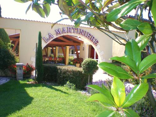 a building with a sign that reads main mariculture at Hotel Restaurant La Martiniere in Montélier
