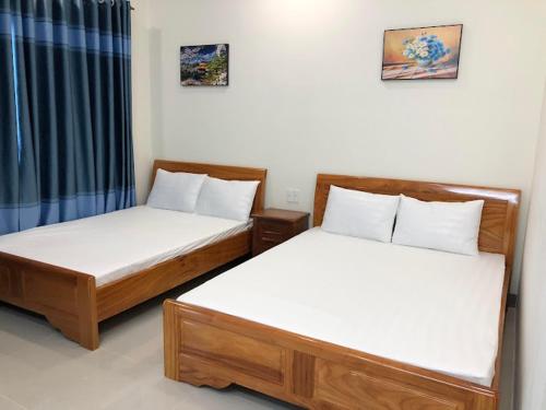 Krevet ili kreveti u jedinici u okviru objekta Nhà Nghỉ Nhung - Nhung Motel