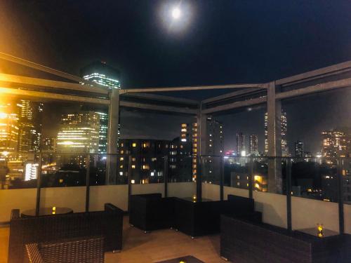 a room with a view of a city at night at HOTEL SUI AKASAKA by ABEST in Tokyo