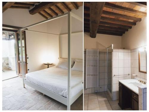 - une chambre avec un lit à baldaquin et une salle de bains dans l'établissement Villa Betta Comfortable holiday residence, à Città di Castello