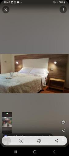 a television screen with a bed in a room at Monte morello in Castiglione