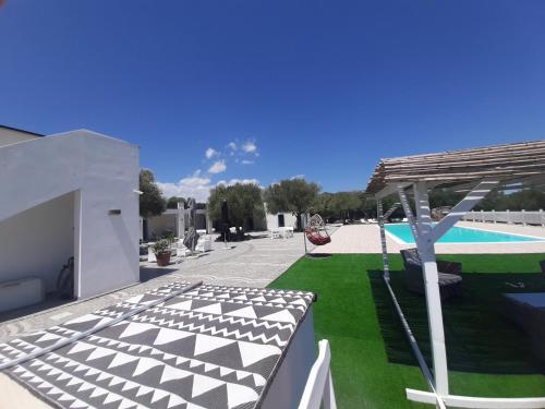 a view of a yard with a swimming pool at Borgo Rurale Cares in Dorgali