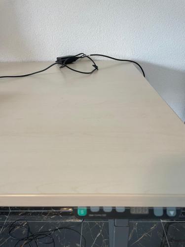 a laptop computer sitting on top of a table at Ferienwohnung Wilusa 2 - Self Checkin in Rheinfelden