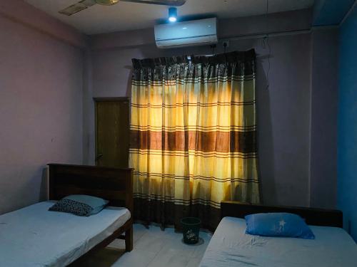 Voodi või voodid majutusasutuse Binara Holiday Resort toas