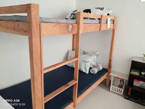 a pair of bunk beds in a room at RY Nest in Malaybalay