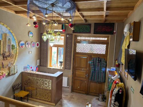 a room with a entrance to a store with a wooden door at Old Palace Hotel in Samarkand