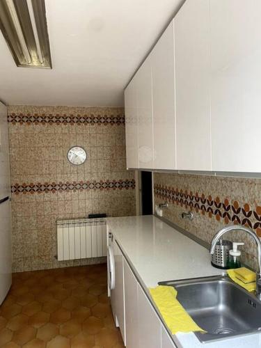 a kitchen with a sink and a counter top at Acogedor chalet en la Sierra in Cercedilla