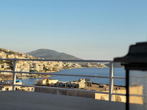a view of a harbor with a train on a ship at Joen Apartments in Sarandë