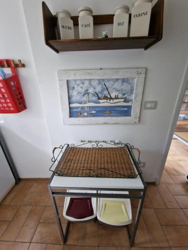 a small table in a room with a shelf at Le Terrazze della Tuscia in Latera
