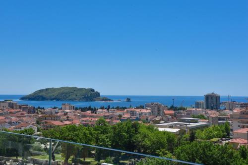 a view of the city and the ocean at New Chill and Go Apartments in Budva