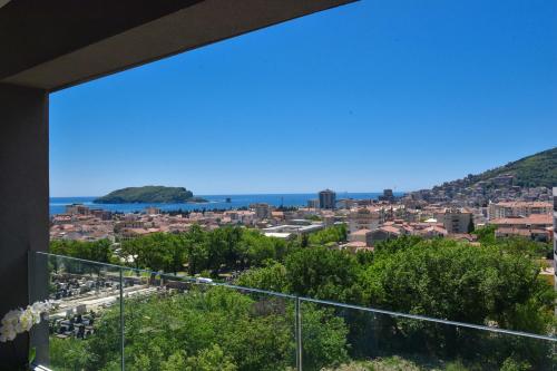 a view of the city from the balcony at New Chill and Go Apartments in Budva