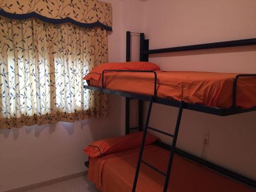 Ένα ή περισσότερα κρεβάτια σε δωμάτιο στο Apartamento acogedor playa Miramar