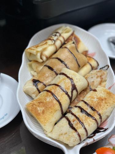 a plate of pastries on a table at Hotel Willa Adriana in Płock