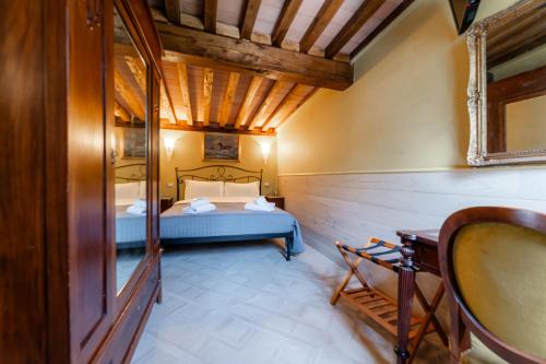 a bedroom with a bed and a wooden ceiling at Luxury House in Green Appia Antica in Rome