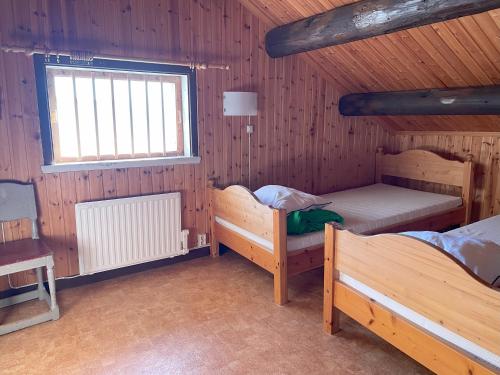 Postel nebo postele na pokoji v ubytování Sandvikens Fiskeläge Ulvön