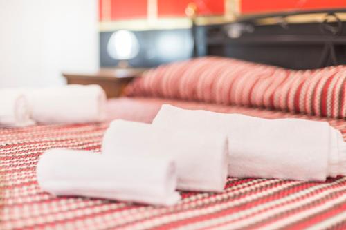 a pile of toilet paper sitting on top of a bed at Villa Giulia - Vesuvio Guest House Pompei Sorrento in Boscotrecase