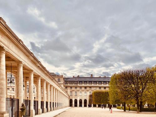 a large building with columns on the side of it at 115 - Urban Vuitton Saint Denis in Paris