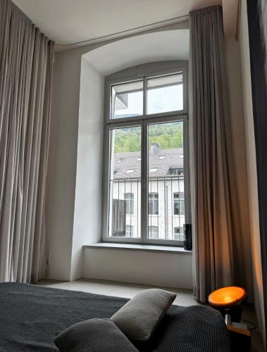 Una cama o camas en una habitación de Design Loft in ehemaliger Spinnerei