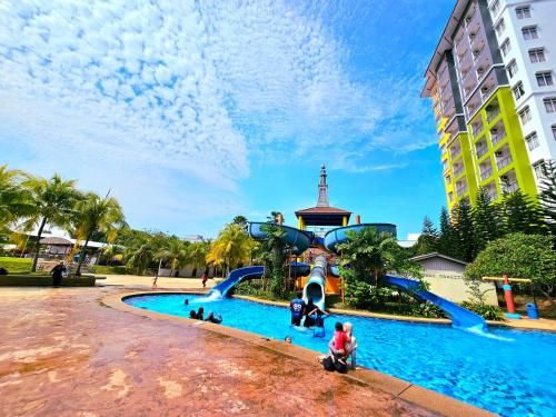 a water slide at a resort with people on it at BY LG Water Themepark Facilities & Suites By GGM in Melaka