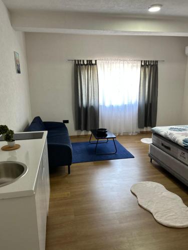 Ένα ή περισσότερα κρεβάτια σε δωμάτιο στο Apartmani Art
