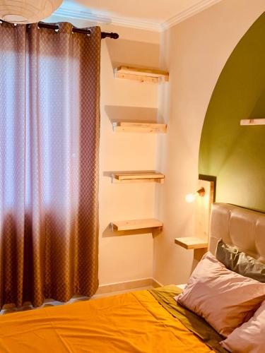 a bedroom with a bed and a window with a curtain at Family Tree - WATER Available - SELF check in in Golem