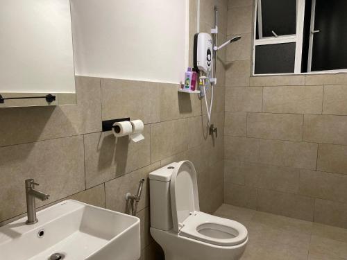 a bathroom with a white toilet and a sink at Mahkota Valley Pool View Studio Suite Indera Mahkota Kuantan near UIA in Kuantan