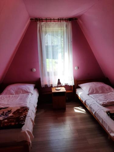 Katil atau katil-katil dalam bilik di Domki nad potokiem w Baligrodzie