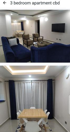 a living room with a blue couch and a table at snazzy guest house in Nakuru