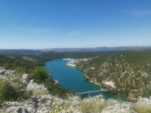 an aerial view of a river with a bridge at Apartmani Marijana in Lozovac