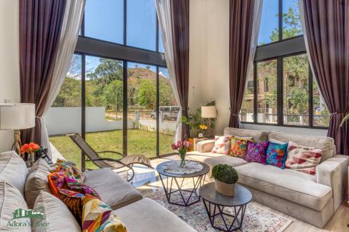 a living room with a couch and a table at Adora's Place - Premium Room in Coron