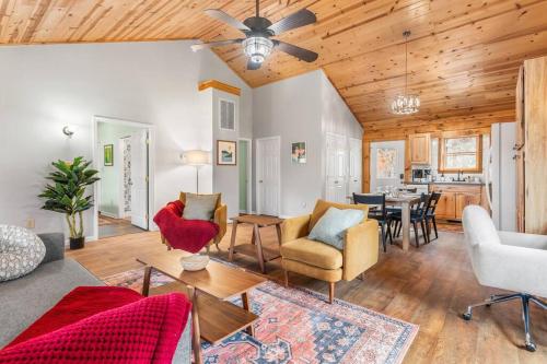 a living room with a couch and chairs and a table at Balk Oasis, Mountain Views,Rustic, HotTub in Stanley