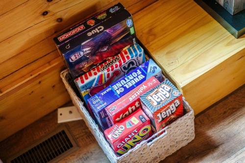 a box of toothpaste and other candy on the floor at Balk Oasis, Mountain Views,Rustic, HotTub in Stanley