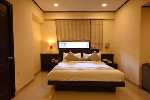 Katil atau katil-katil dalam bilik di Little Chef Hotel