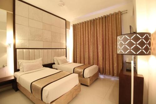 Katil atau katil-katil dalam bilik di Hotel Executive Silver Inn